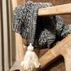 image:imageSAFAVIEH Home Pennie Black and Natural Knit Tassel Throw Blanket